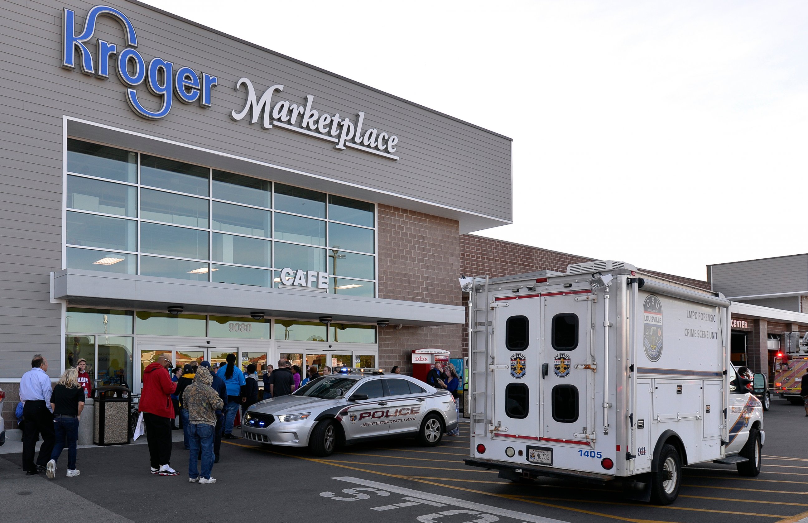 PHOTO: Employees wait outside the entrance of a Kroger grocery following a shooting that left two people dead and a suspect in custody, Wednesday, Oct. 24, 2018, in Jeffersontown, Ky.