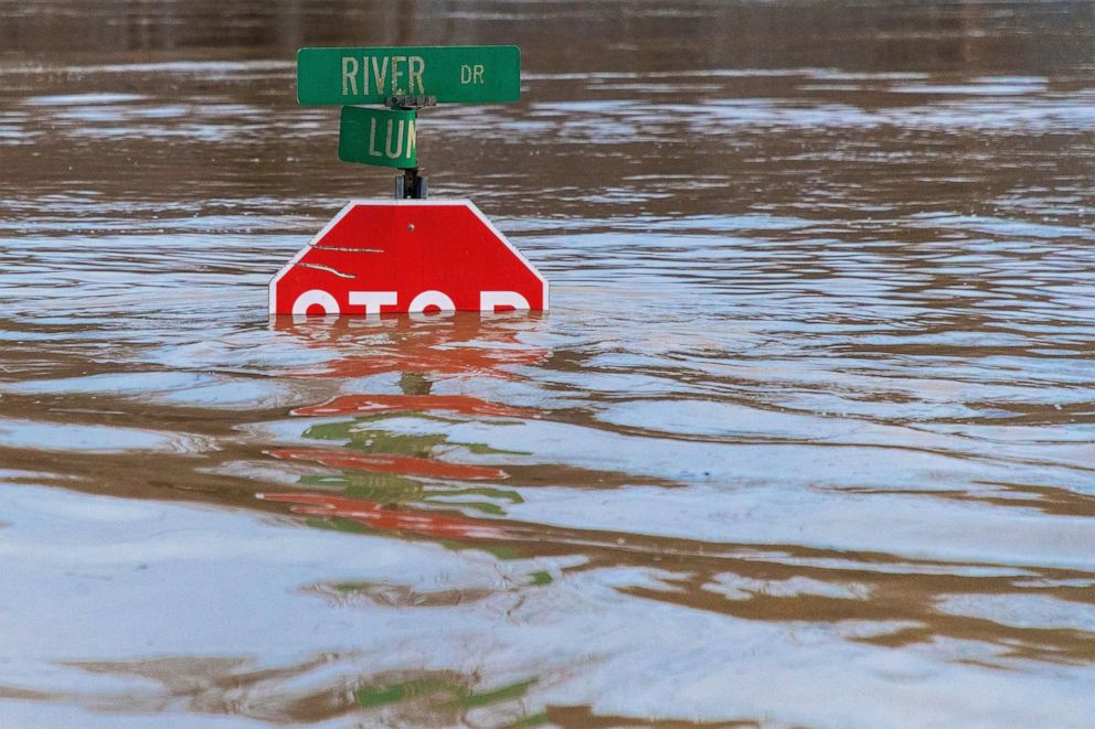 PHOTO: A road sign is submerged in water after flooding from heavy rains, March 1, 2021, in Beattyville, Ky.