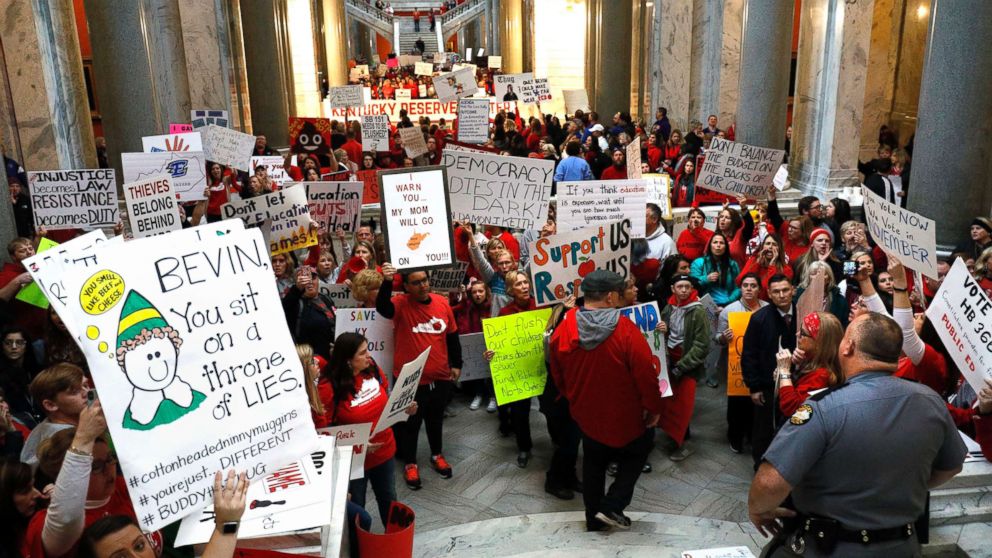 PHOTO: Public school teachers and their supporters protest against a pension reform bill outside the senate chambers at the Kentucky State Capital, April 2, 2018 in Frankfort, Ky.