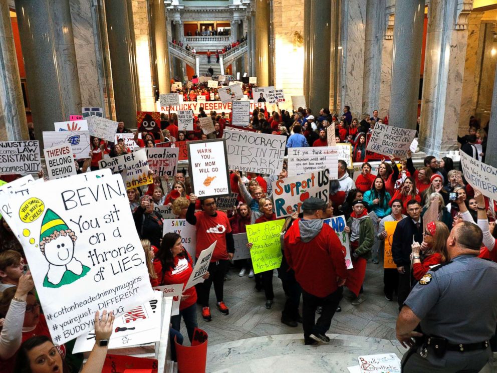 PHOTO: Public school teachers and their supporters protest against a pension reform bill outside the senate chambers at the Kentucky State Capital, April 2, 2018 in Frankfort, Ky.