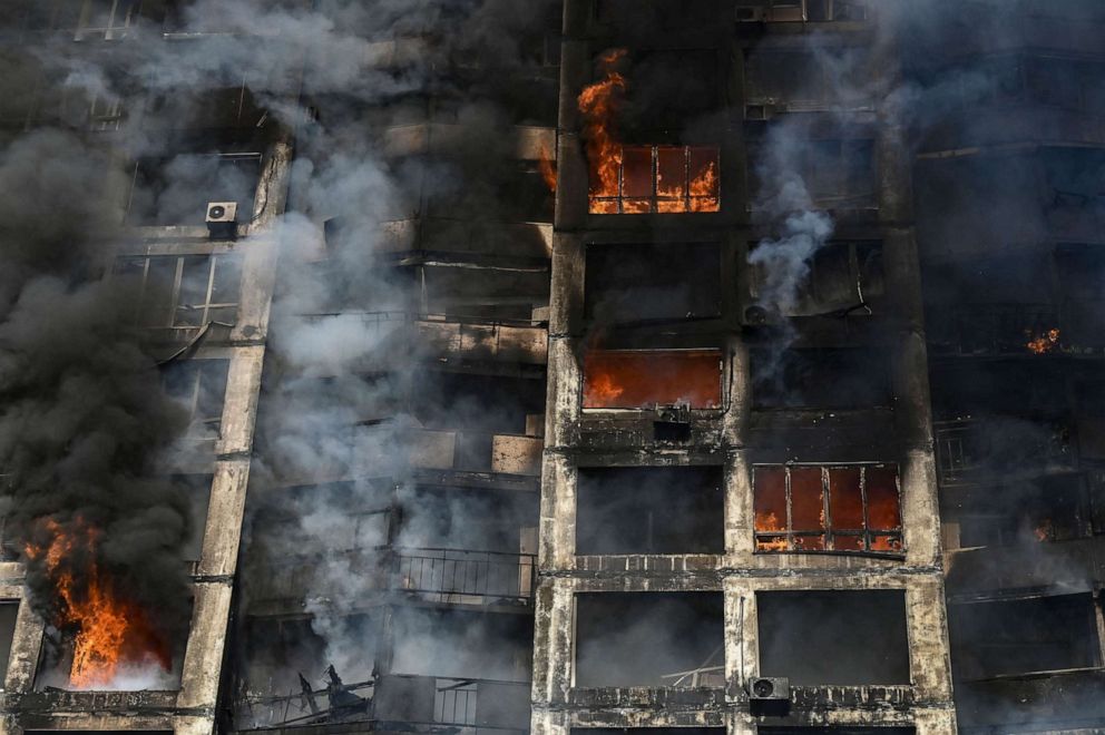 PHOTO: Firefighters extinguish a fire in an apartment building in Kyiv, Ukraine, March 15, 2022.