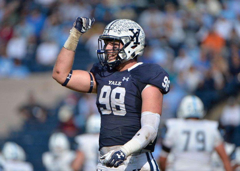 PHOTO: Yale Bulldogs defensive end Kyle Mullen gestures to the crowd during the game between the Yale Bulldogs and the Columbia Lions on Oct. 28, 2017 at Yale Bowl in New Haven, Conn.