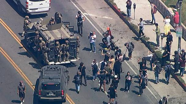 U.S. troops accompany federal agents in a immigration enforcement operation in Los Angeles, July 7, 2025.