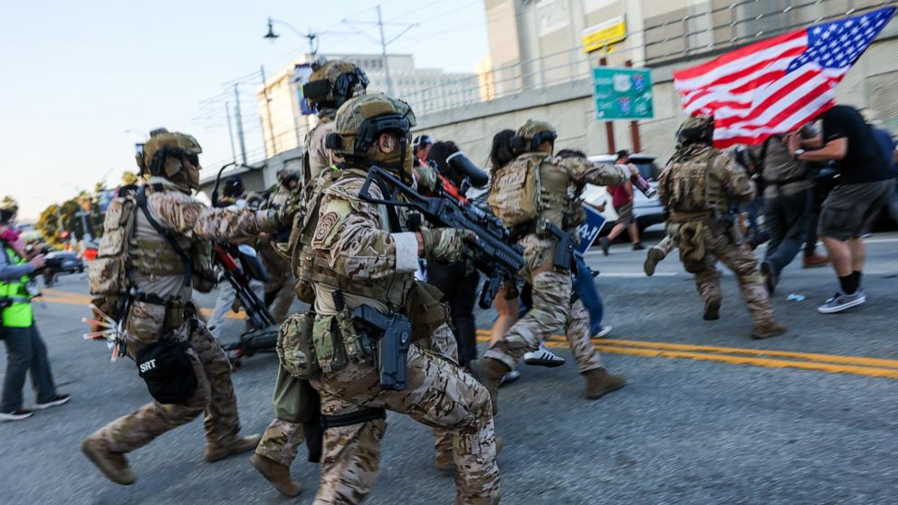 PHOTO: Members of the Sheriff's Response Team attempt to control protesters in downtown as demonstrations continue, June 12, 2025, in Los Angeles.
