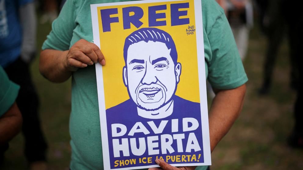 PHOTO: A demonstrator holds a placard during a rally against the detention of SEIU California and SEIU-USWW union president David Huerta amid federal immigration sweeps in downtown Los Angeles, June 9, 2025. 