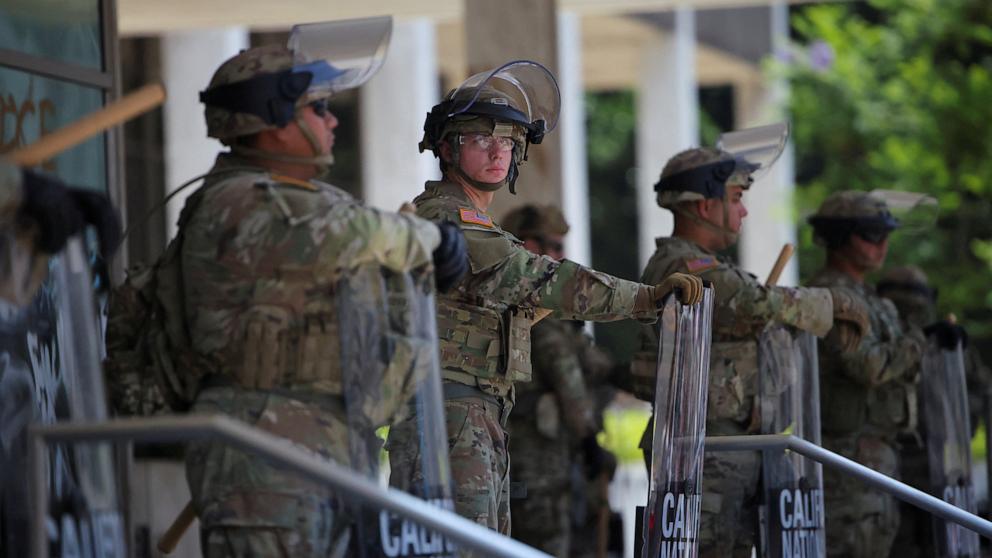 PHOTO: California National Guard troops stand outside the Edward R. Roybal Federal Building after their deployment by U.S. President Donald Trump, in response to protests against immigration sweeps, in Los Angeles, June 9, 2025.