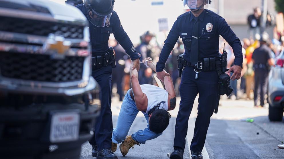 PHOTO: A protestor is detained in downtown Los Angeles, June 8, 2025.