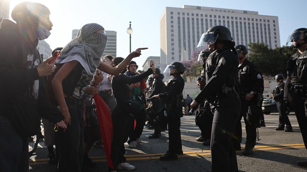 PHOTO: Protesters face off with members of the Los Angeles police department outside of the Edward R. Roybal Federal Building in Los Angeles, June 9, 2025.