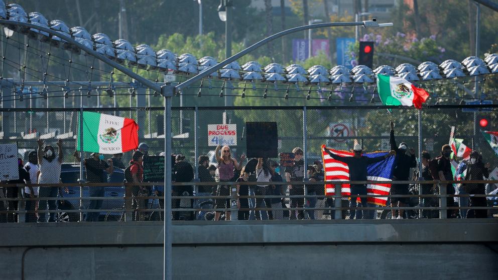 PHOTO: Demonstrators protest against federal immigration sweeps, in downtown Los Angeles, June 8, 2025.