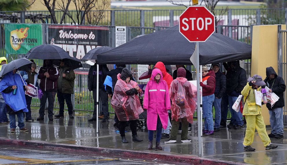PHOTO: Los Angeles Unified School District (LAUSD) teachers and Service Employees International Union 99 (SEIU) members strike during heavy rain outside the Edward R. Roybal Learning Center in Los Angeles, March 21, 2023.