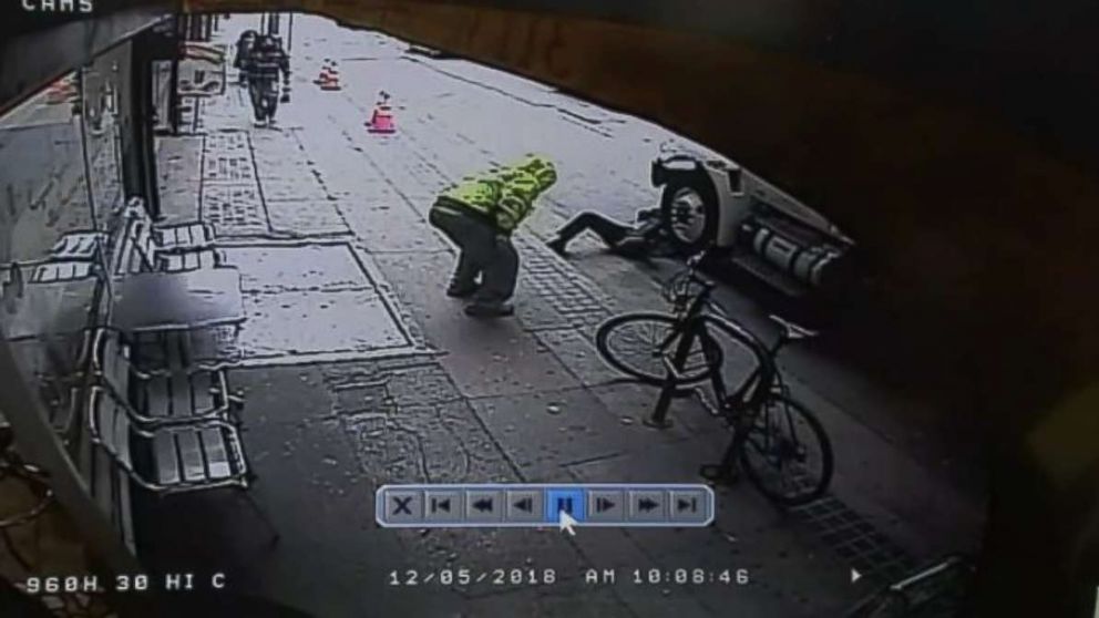 PHOTO: Surveillance video shows a man pushing a random passerby in front of a truck in downtown Los Angeles on Wednesday, Dec. 5, 2018.