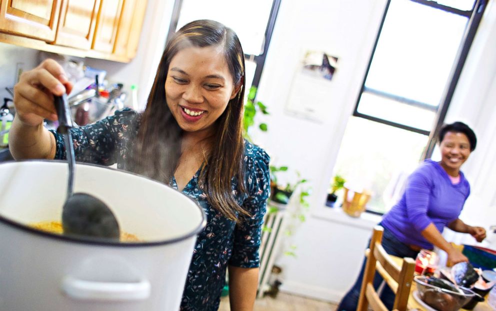 PHOTO: Edith Mendoza, left, and Sherile Pahagas, right, prepare a meal together in the home of Juana Dwyer, Oct. 28, 2017. Mendoza and Pahagas worked as live-in domestic employees in New York and are suing their former employers.