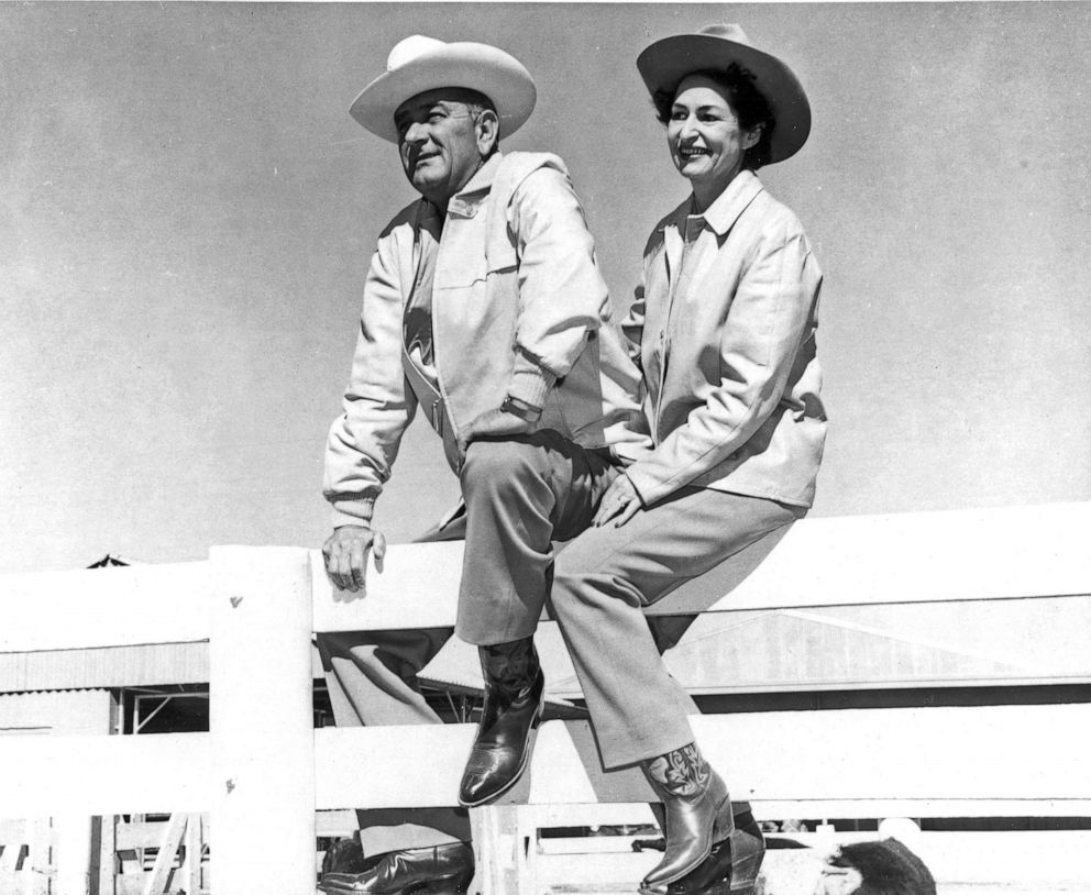 PHOTO: President Lyndon B. Johnson and his wife, First Lady Lady Bird Johnson pose seated atop a fence at their ranch, Johnson City, Texas, 1963.