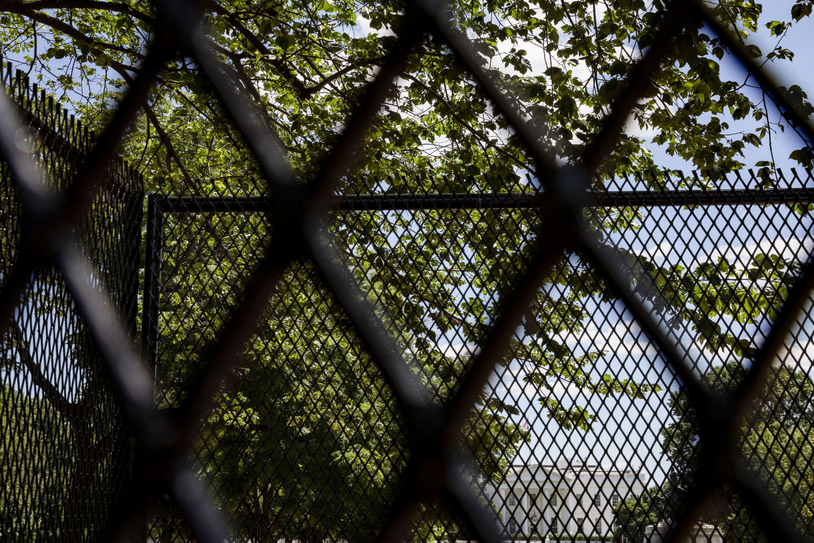 PHOTO: The White House is seen through the security fencing put in place to prevent protestors from approaching through Lafayette Park during demonstrations over the death of George Floyd, June 7, 2020, in Washington, D.C.