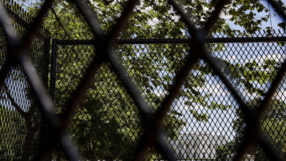 PHOTO: The White House is seen through the security fencing put in place to prevent protestors from approaching through Lafayette Park during demonstrations over the death of George Floyd, June 7, 2020, in Washington, D.C.