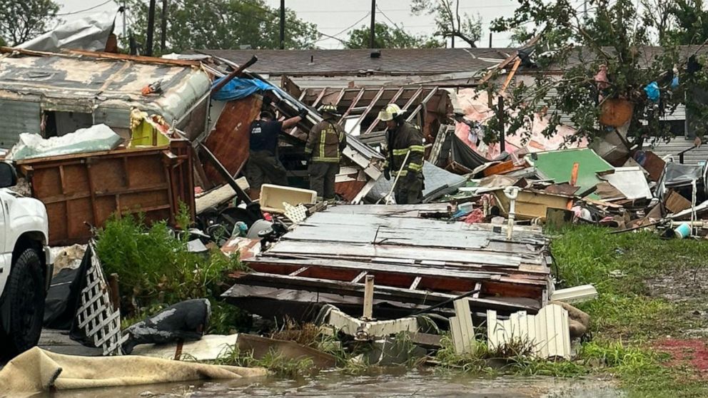 PHOTO: First responders look through rubble after a tornado touched down in Laguna Heights, Texas, on May 13, 2023.