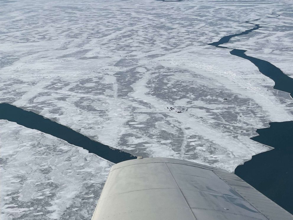 PHOTO: People stand on ice floe awaiting rescue on Lake Erie near Catawamba Island, Ohio, Feb. 6, 2022.