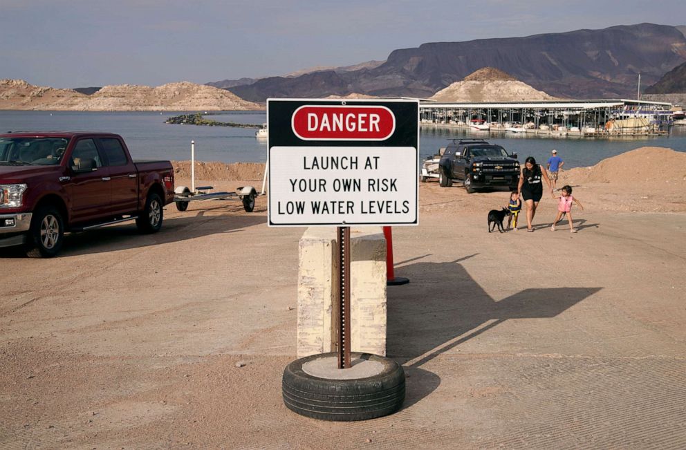 PHOTO: A sign warns of low water levels at a boat ramp on Lake Mead at the Lake Mead National Recreation Area, Aug. 13, 2021, near Boulder City, Nev.