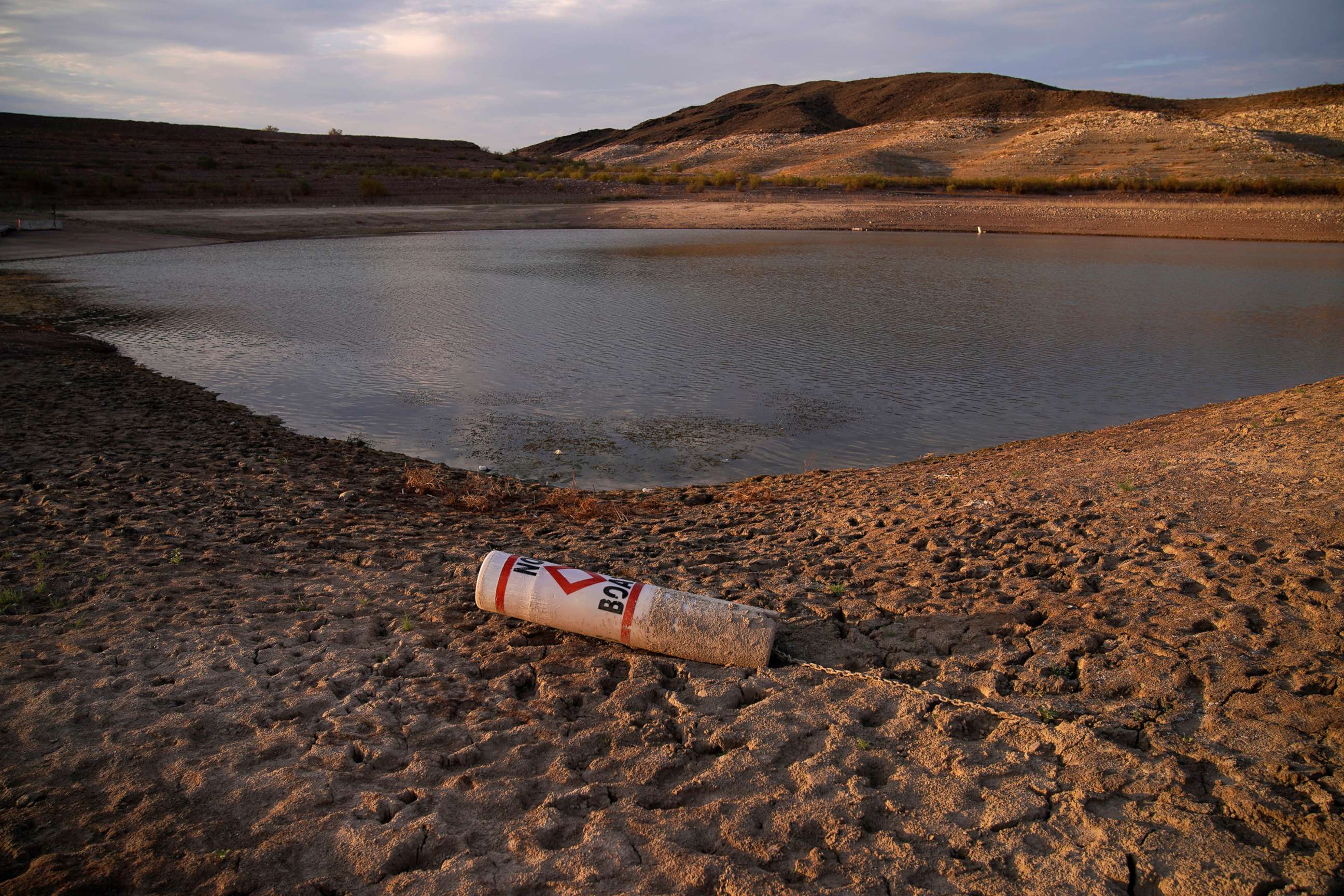 PHOTO: A buoy rests on the ground at a closed boat ramp on Lake Mead, Aug. 13, 2021, at the Lake Mead National Recreation Area near Boulder City, Nev. 