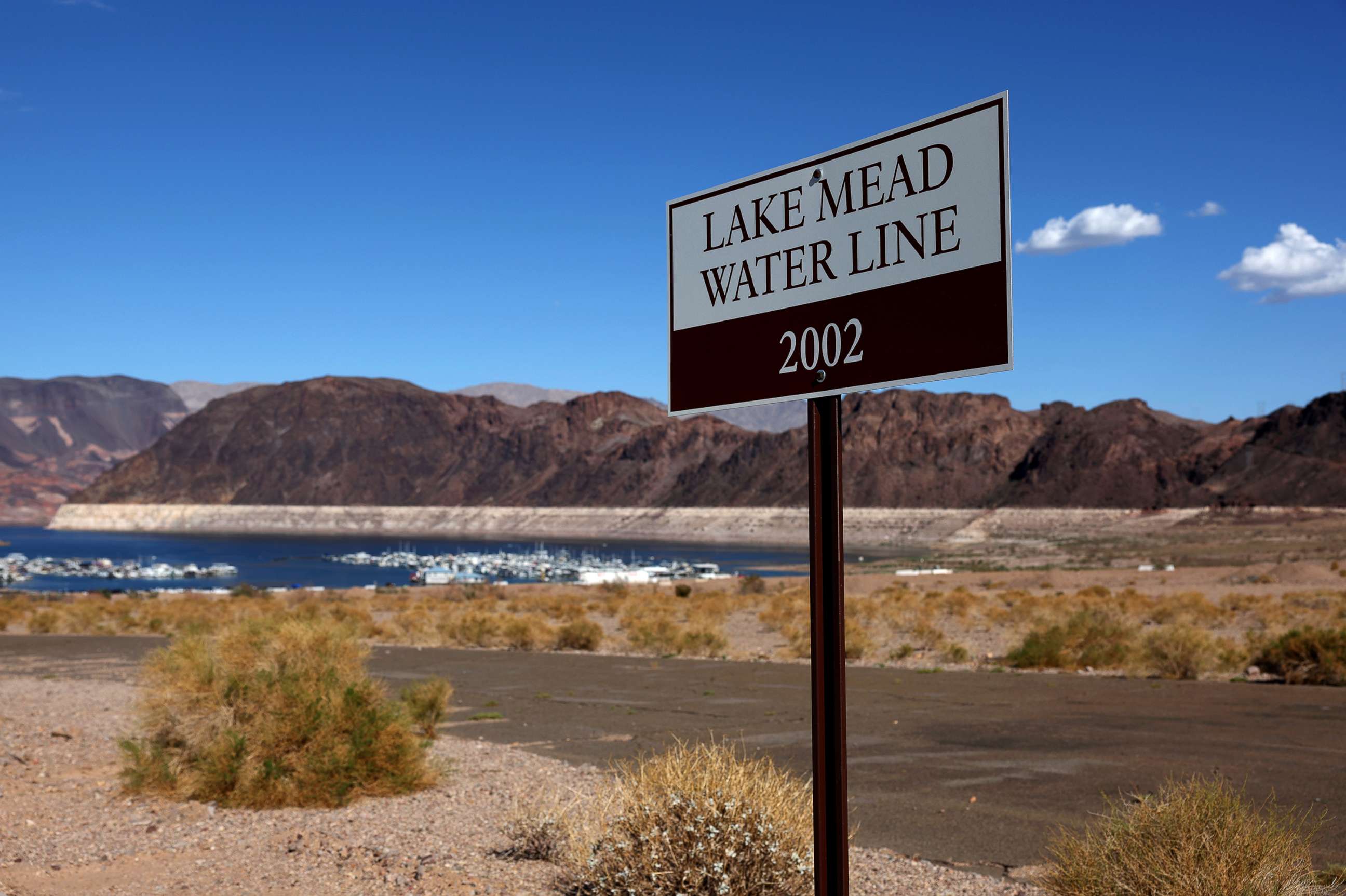 PHOTO: A sign showing where Lake Mead water levels were in 2002 is posted near the Lake Mead Marina, Aug. 19, 2022, in Lake Mead National Recreation Area, Nevada.