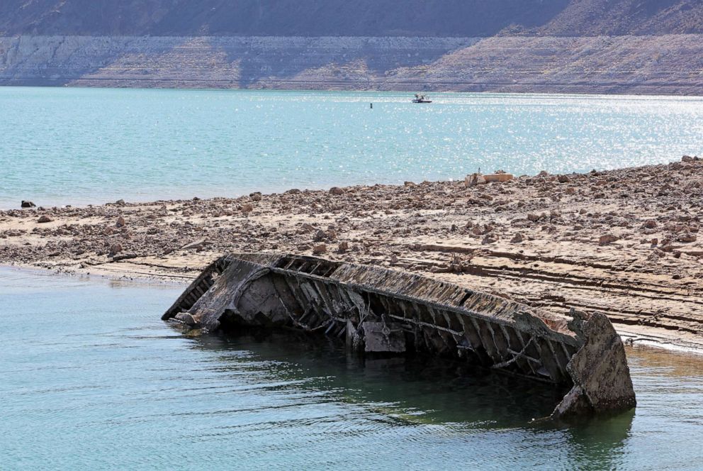 PHOTO: A sunken World War II-Era Higgins landing craft that was nearly 200 feet underwater, is revealed near the Lake Mead Marina as the waterline continues to recede due to ongoing drought in the Lake Mead National Recreation Area, Nev., July 1, 2022. 