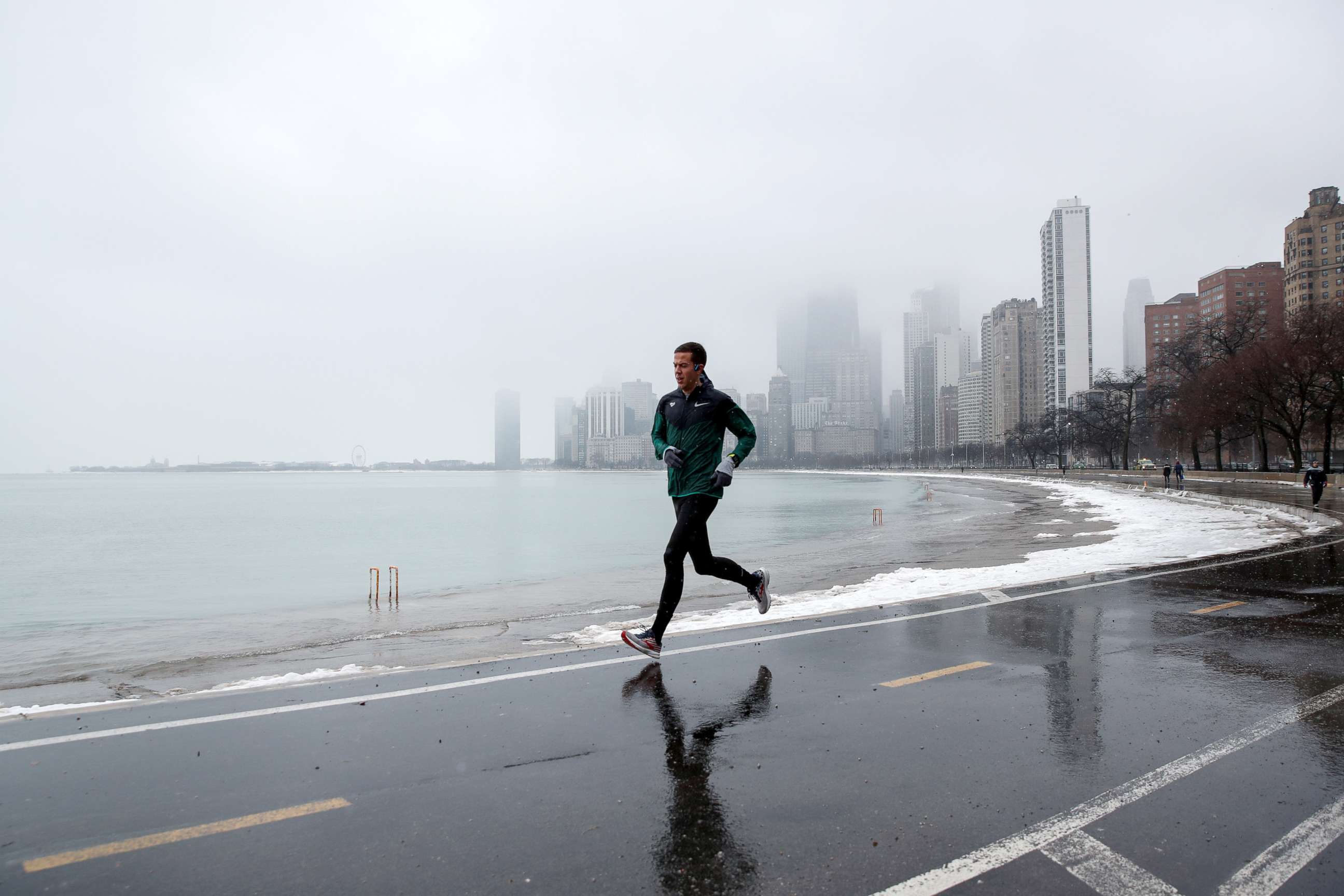 PHOTO: A man runs along Lake Michigan in Chicago, Illinois, Jan. 25, 2020.