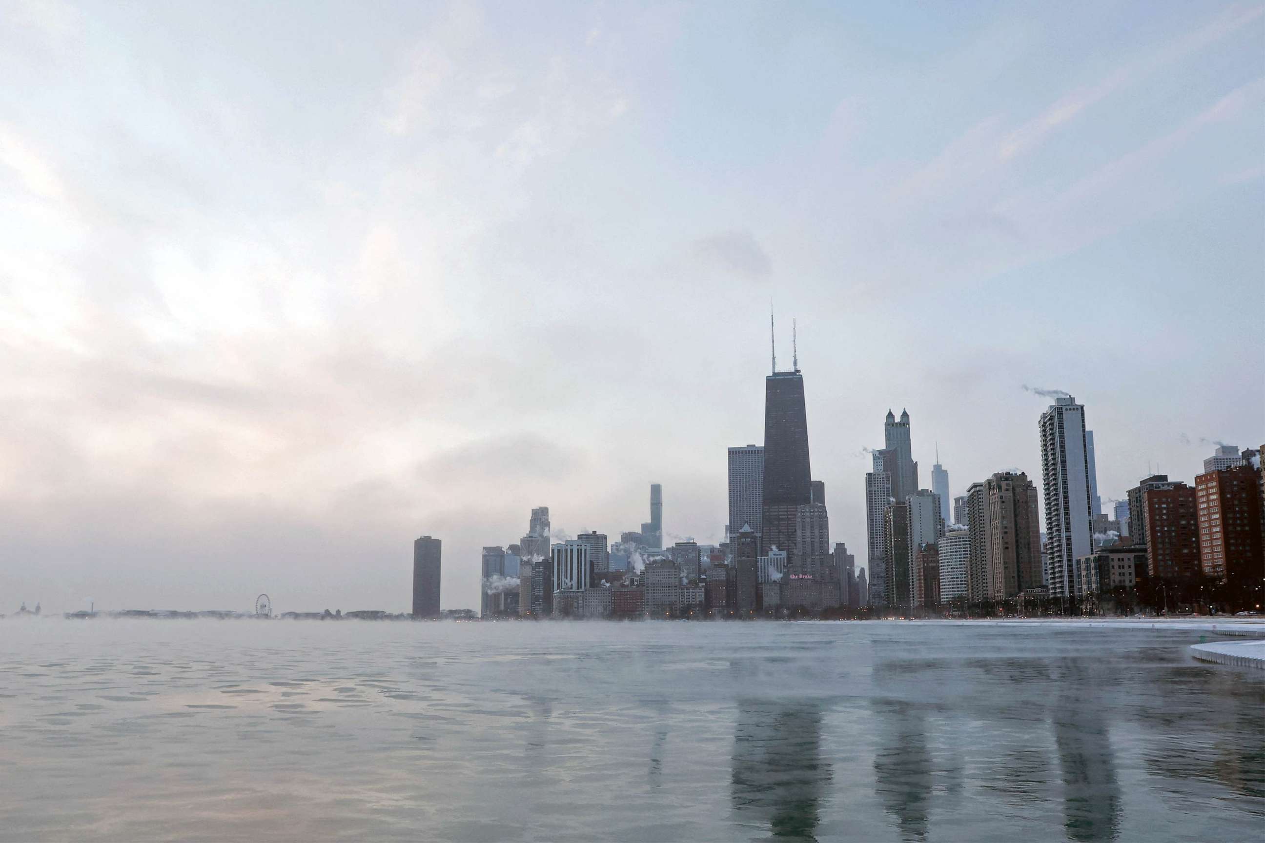 PHOTO: FILE - In this file photo taken, Dec. 23, 2022, mist rises from Lake Michigan at sunrise in Chicago.