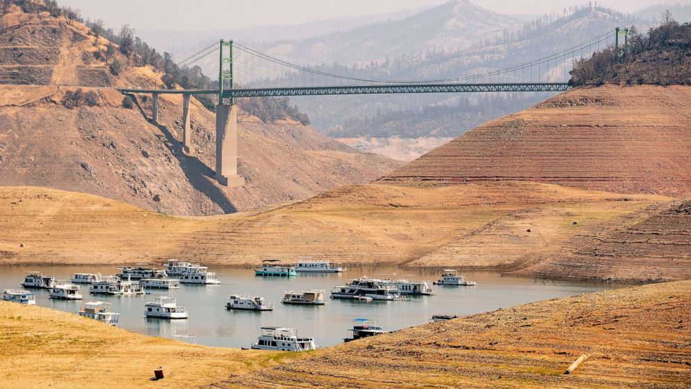PHOTO: In this Sept. 5, 2021, file photo, houseboats sit in a narrow section of water in a depleted Lake Oroville, in Oroville, Calif.