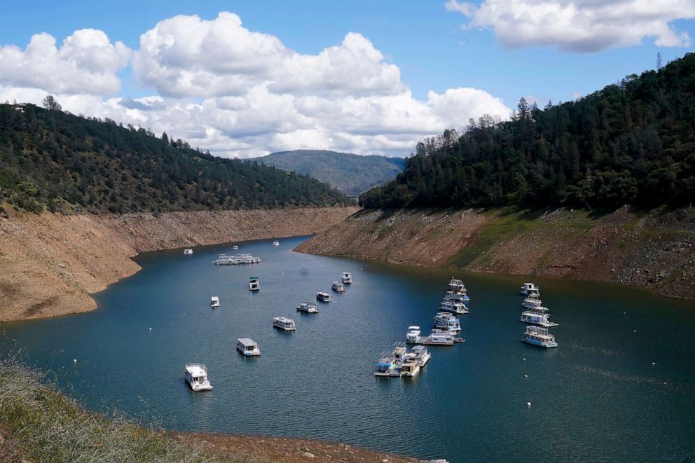 PHOTO: Houseboats sit in the drought lowered waters of Oroville Lake, near Oroville, Calif., April 19, 2022.