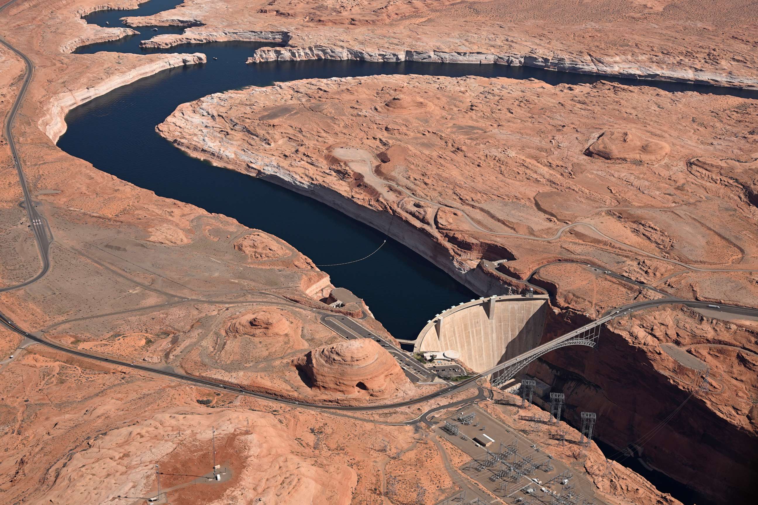 PHOTO: Glen Canyon Dam holds back Colorado River water to create Lake Powell on April 15, 2023 in Lake Page, Ariz.