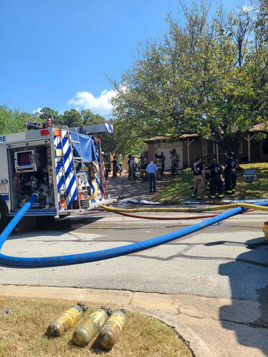 PHOTO: First responders are seen near the site where a military training aircraft crashed into a residential neighborhood in Lake Worth, Texas, Sept. 19, 2021.