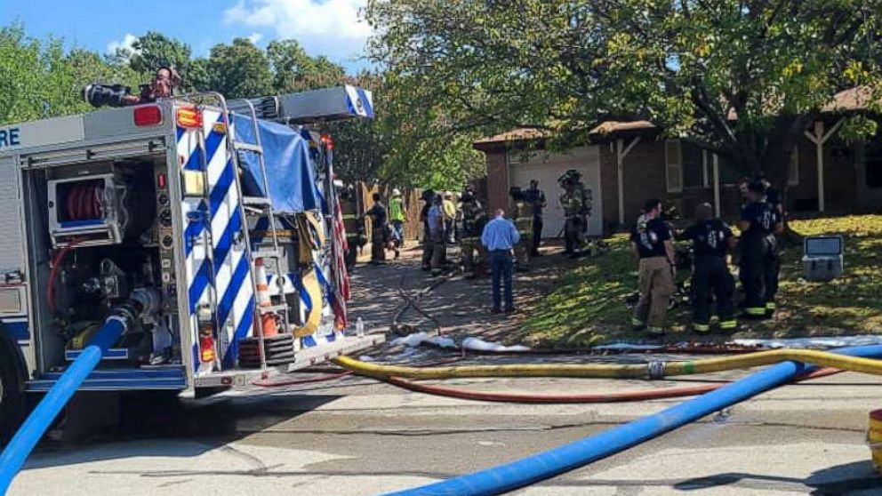 PHOTO: First responders are seen near the site where a military training aircraft crashed into a residential neighborhood in Lake Worth, Texas, Sept. 19, 2021.