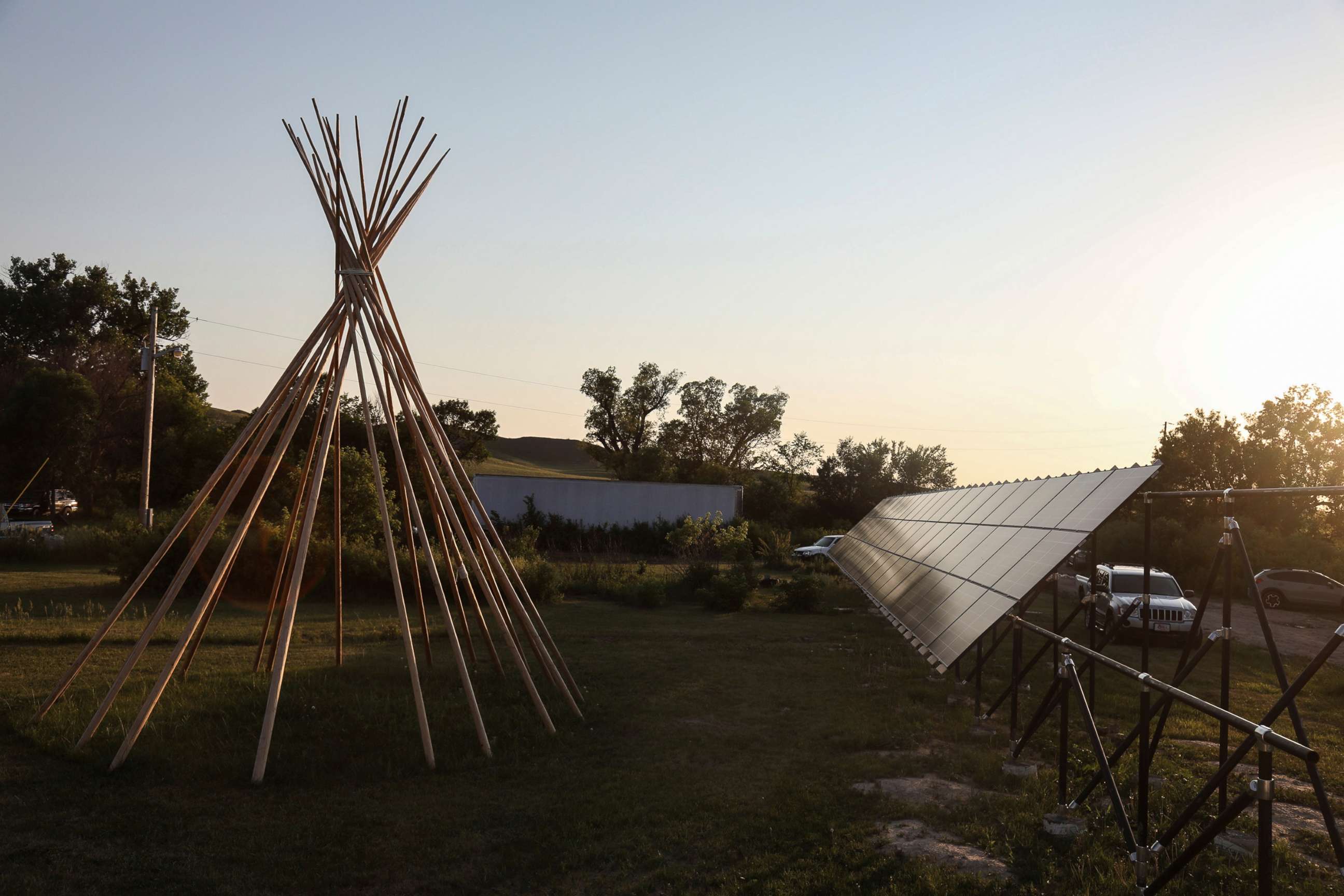 PHOTO: A teepee is reflected onto a solar panel on the Pine Ridge reservation in South Dakota, June 16, 2021.