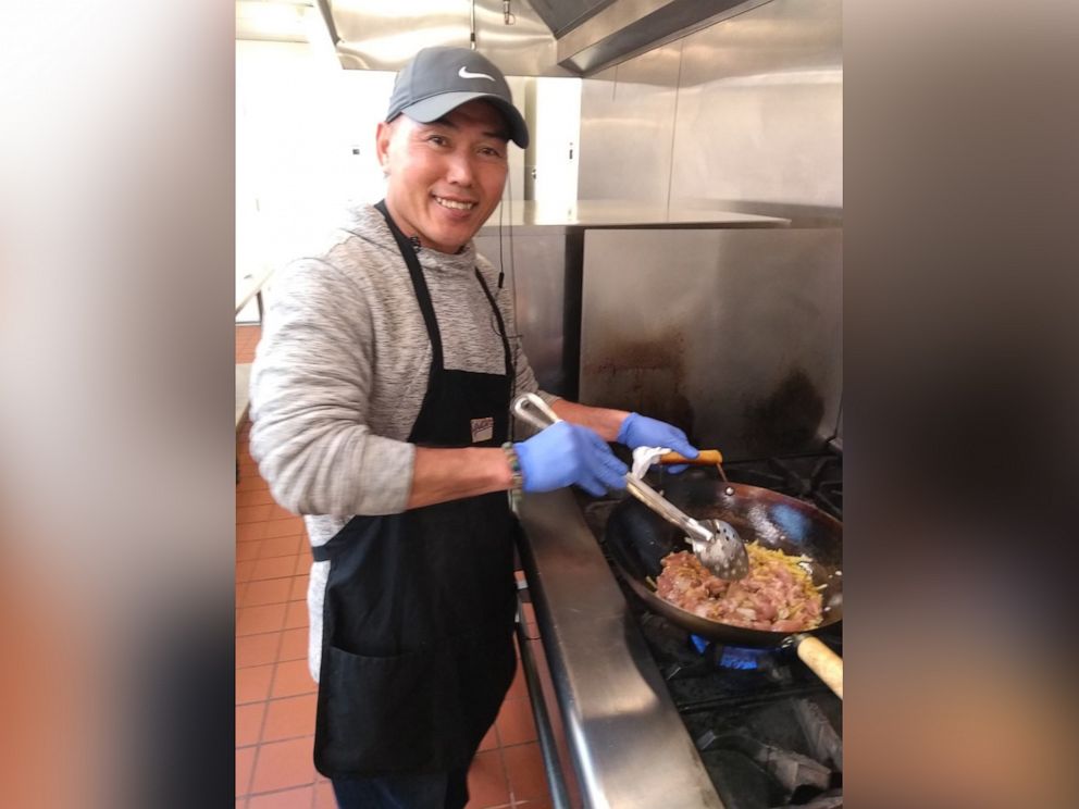 PHOTO: Lam Le works as a volunteer chef at New Life Bowls in Oakland, Calif., in 2020.