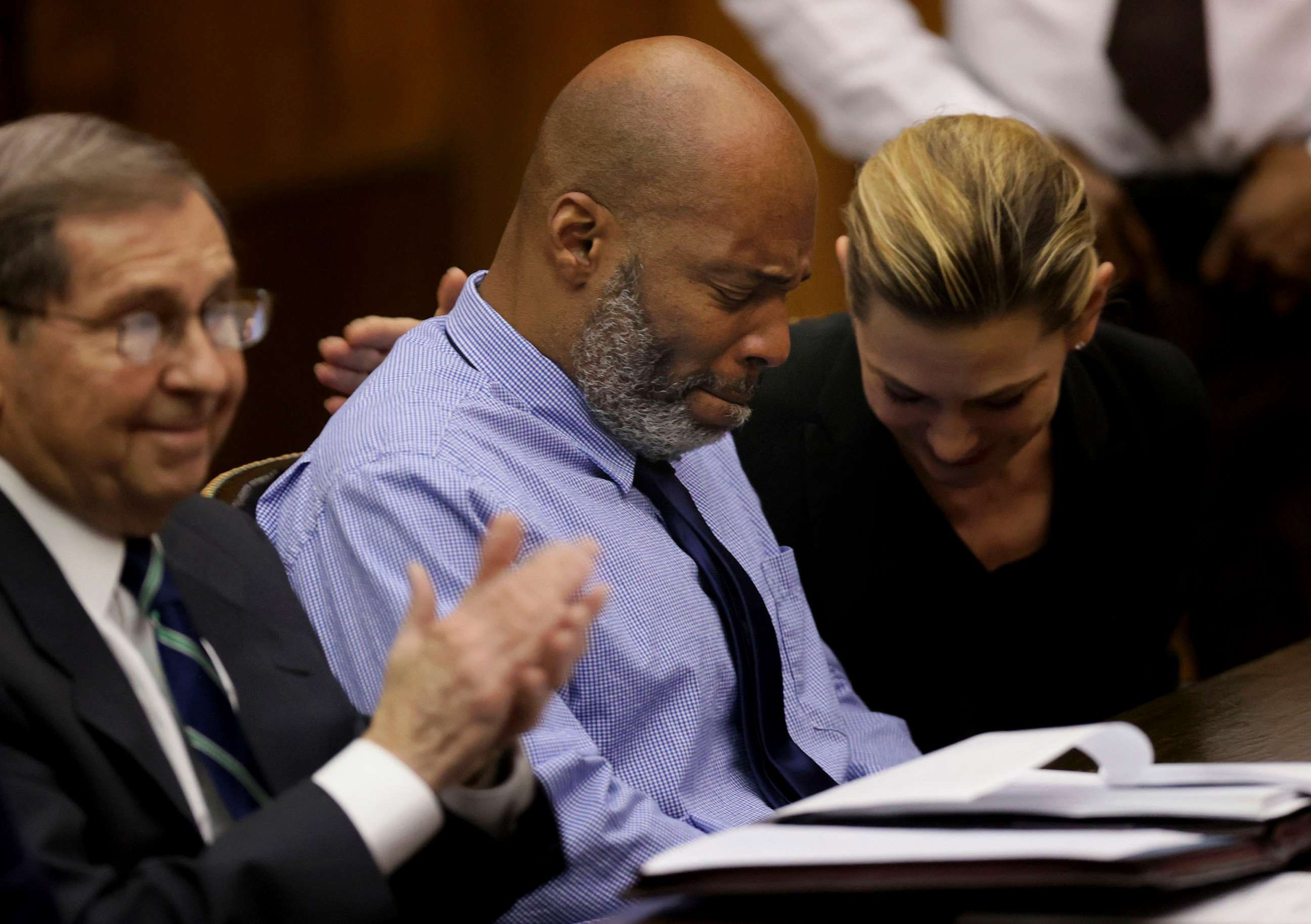 PHOTO: Lamar Johnson, center and his attorneys react after St. Louis Circuit Judge David Mason vacated his murder conviction during a hearing, Feb. 14, 2023, in St. Louis.