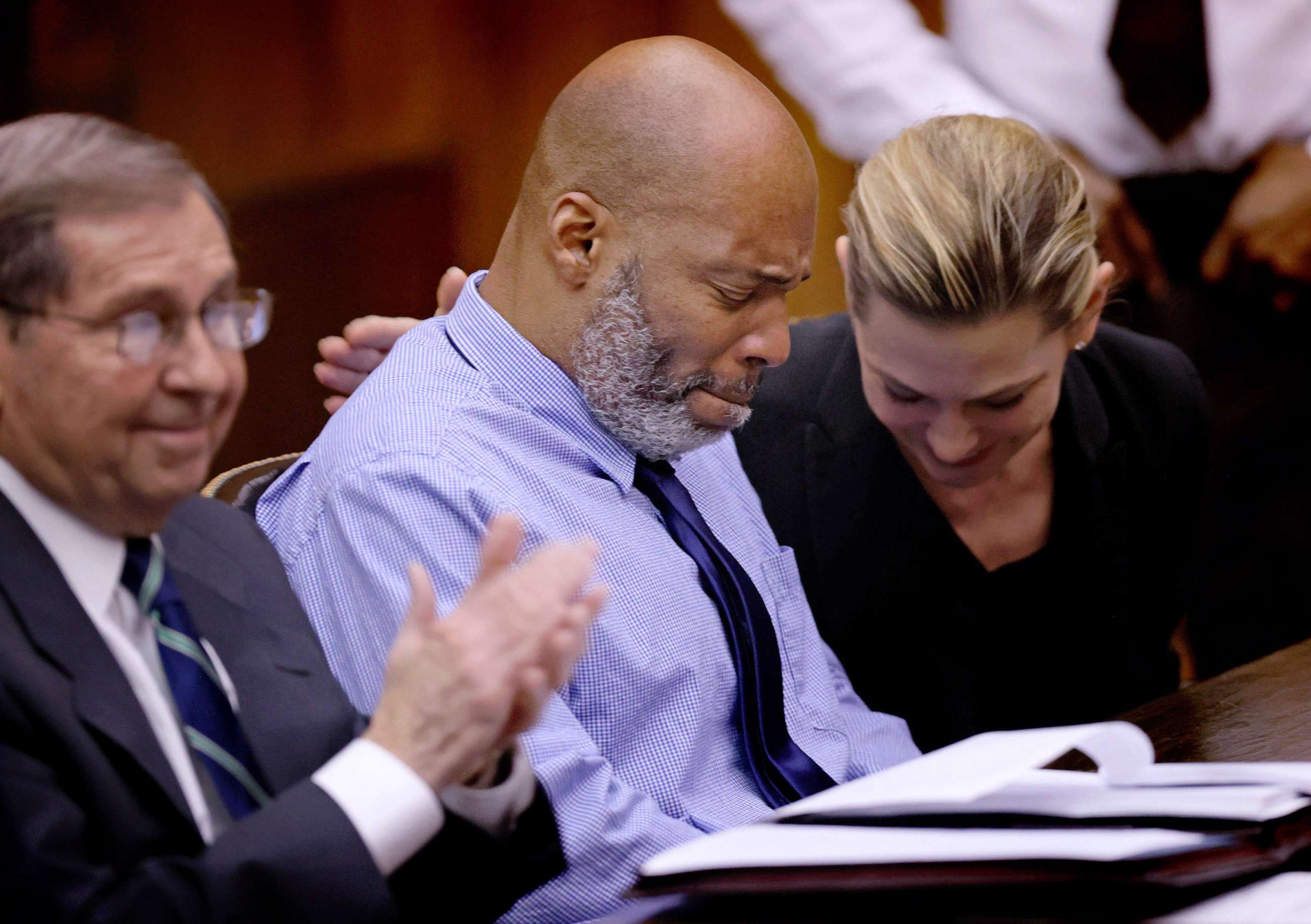PHOTO: Lamar Johnson, center and his attorneys react, Feb. 14, 2023, after St. Louis Circuit Judge David Mason vacated his murder conviction during a hearing at Mel Carnahan Courthouse in St. Louis.
