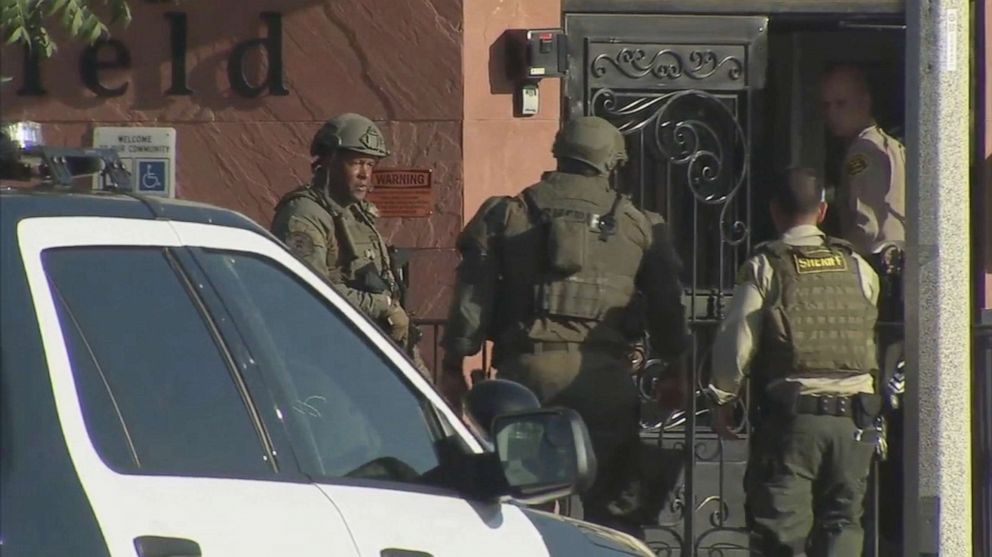 PHOTO: The police search the shooter after a sheriff's deputy was shot dead while he was heading to his car in a parking lot in Lancaster, California on August 21, 2019.