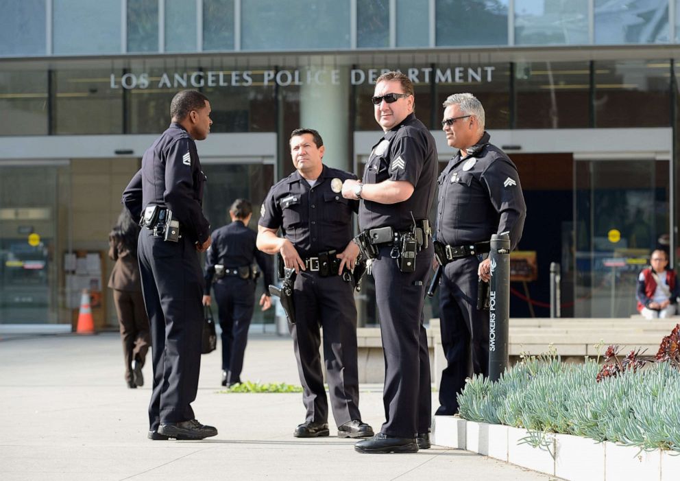 PHOTO: Los Angeles Police Department officers are deployed around the police headquarters, Feb. 7, 2013, in Los Angeles.