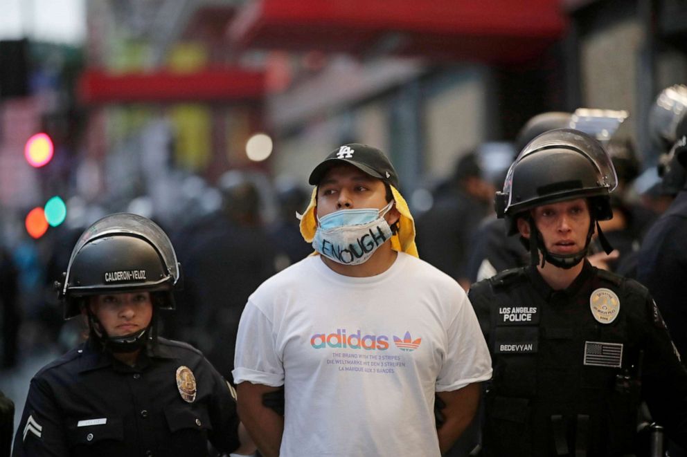 PHOTO: A demonstrator is taken into custody after the city's curfew went into effect in Los Angeles, June 2, 2020.