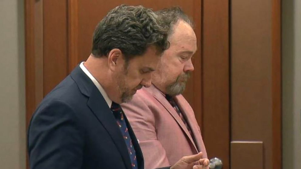 Former Detective Troy Allen Large, right, with his lawyer during a court appearance before his death in January 2018.