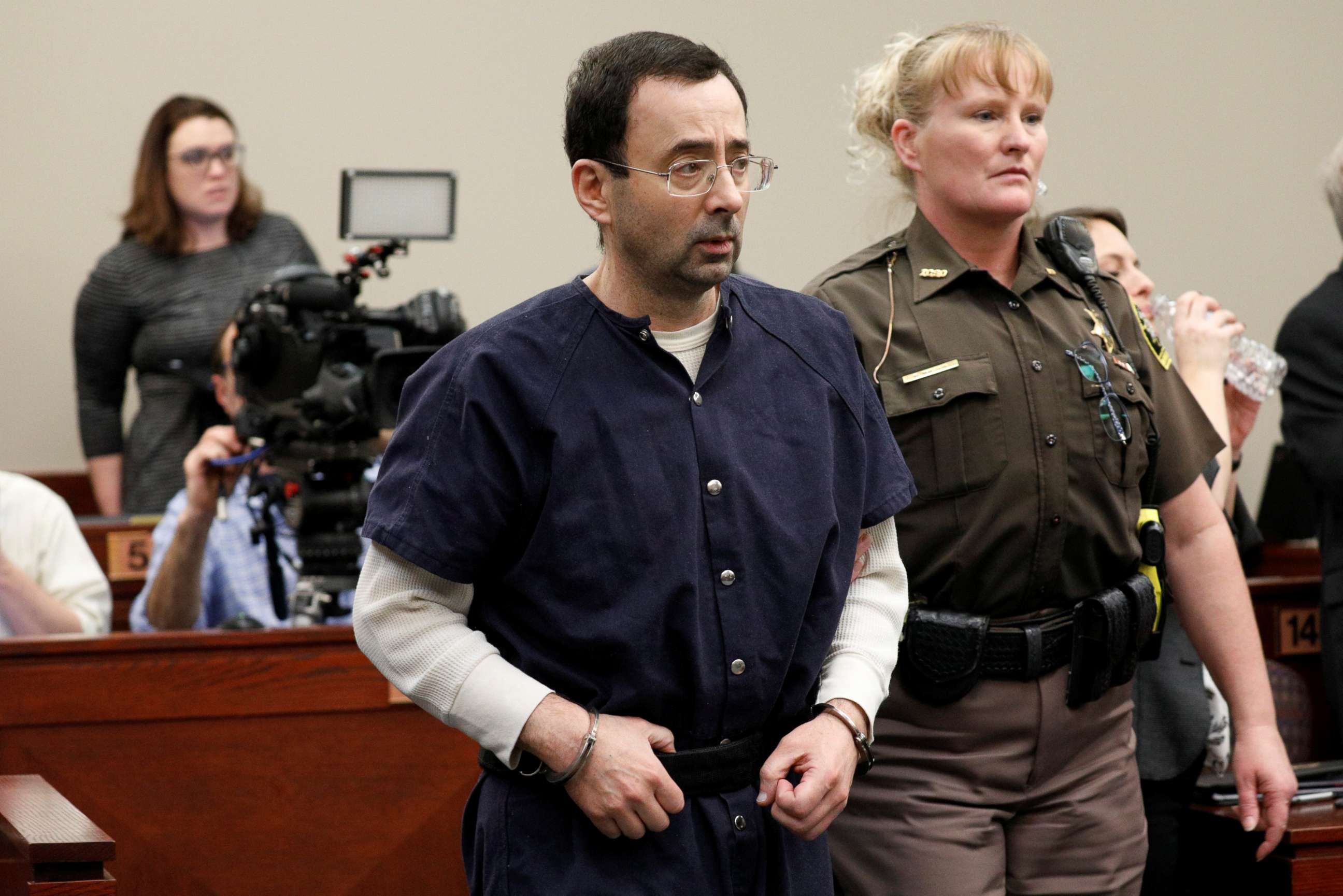 PHOTO: Larry Nassar, a former team USA Gymnastics doctor, who pleaded guilty in Nov. 2017 to sexual assault charges, is led from the courtroom after listening to victim testimony during his sentencing hearing in Lansing, Mich., Jan. 23, 2018. 