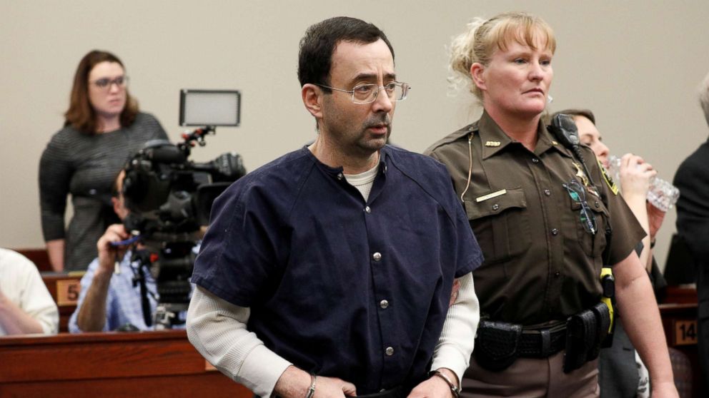 PHOTO: Larry Nassar, a former team USA Gymnastics doctor, who pleaded guilty in Nov. 2017 to sexual assault charges, is led from the courtroom after listening to victim testimony during his sentencing hearing in Lansing, Mich., Jan. 23, 2018. 