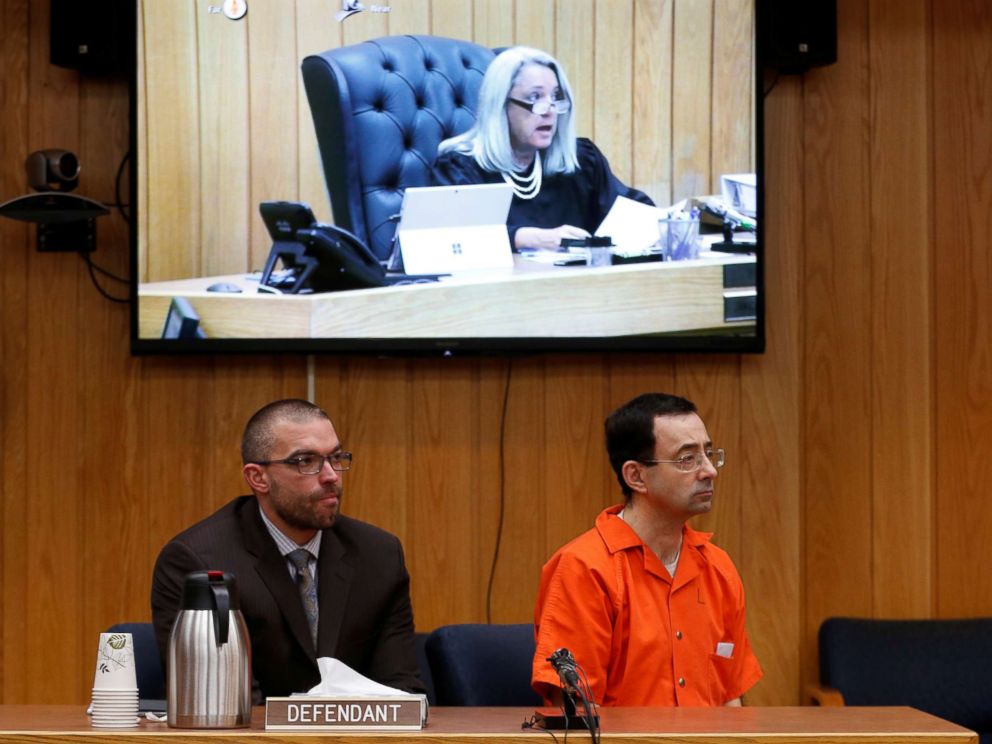 PHOTO: Defendant Larry Nassar and his defense attorney Matt Newburg listen to Judge Janice Cunningham hand down his prison sentence during the sentencing hearing of Nassar in Charlotte, Michigan, Feb. 5, 2018.
