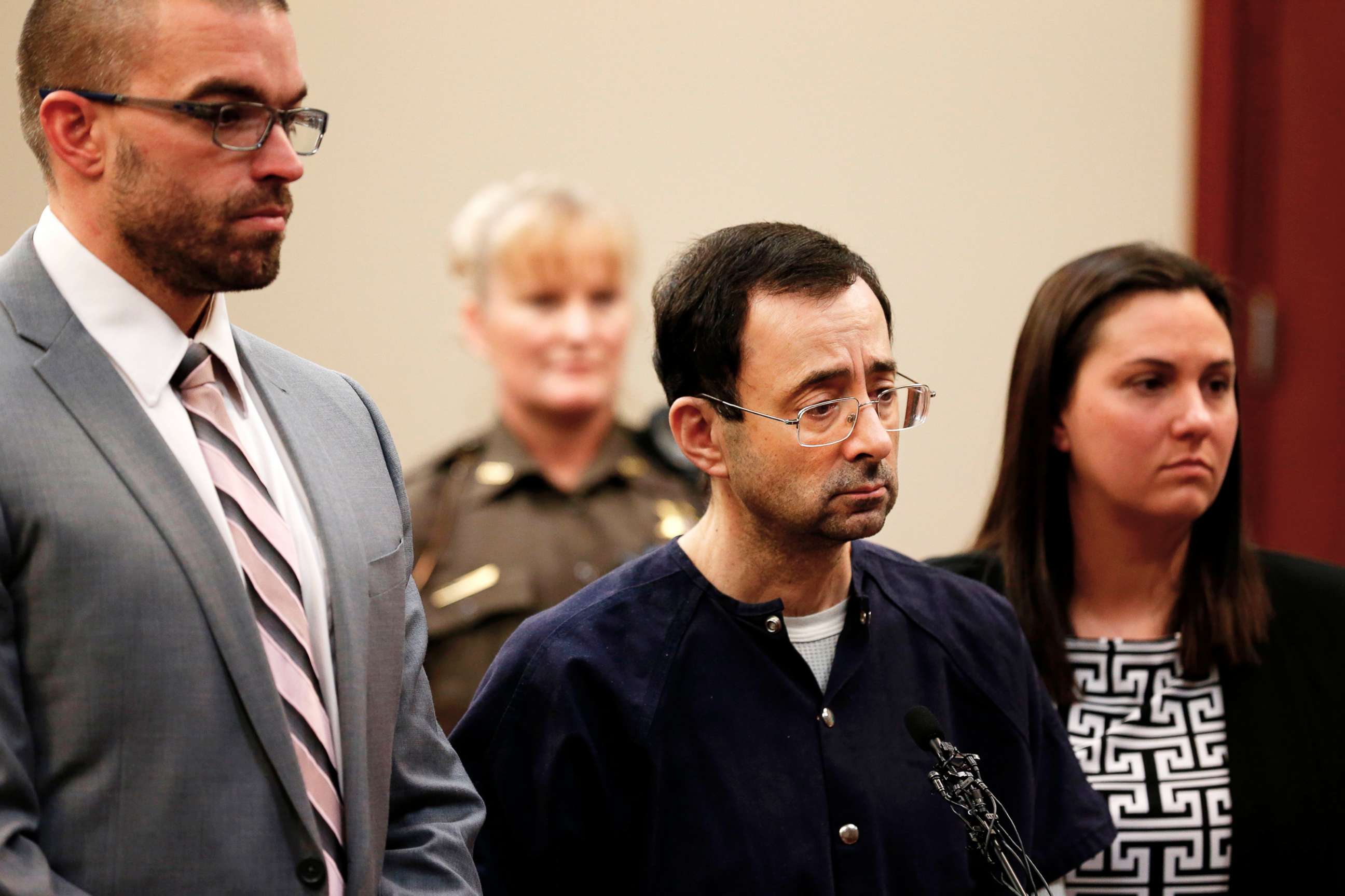 PHOTO: Former Michigan State University and USA Gymnastics doctor Larry Nassar (C) with defense attorneys  Matt Newberg (L) and Molly Blythe (R) during the sentencing phase in Ingham County Circuit Court on Jan. 4, 2018 in Lansing, Mich.