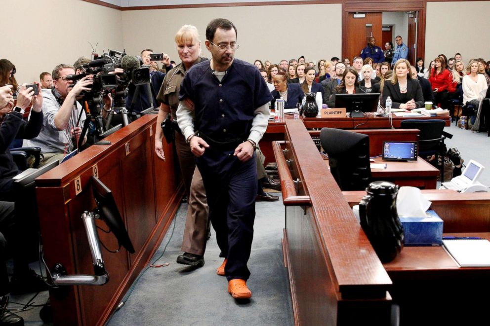 PHOTO: Larry Nassar, a former team USA Gymnastics doctor who pleaded guilty to sexual assault charges, is escorted into the courtroom during his sentencing hearing in Lansing, Mich., on Jan. 24, 2018.
