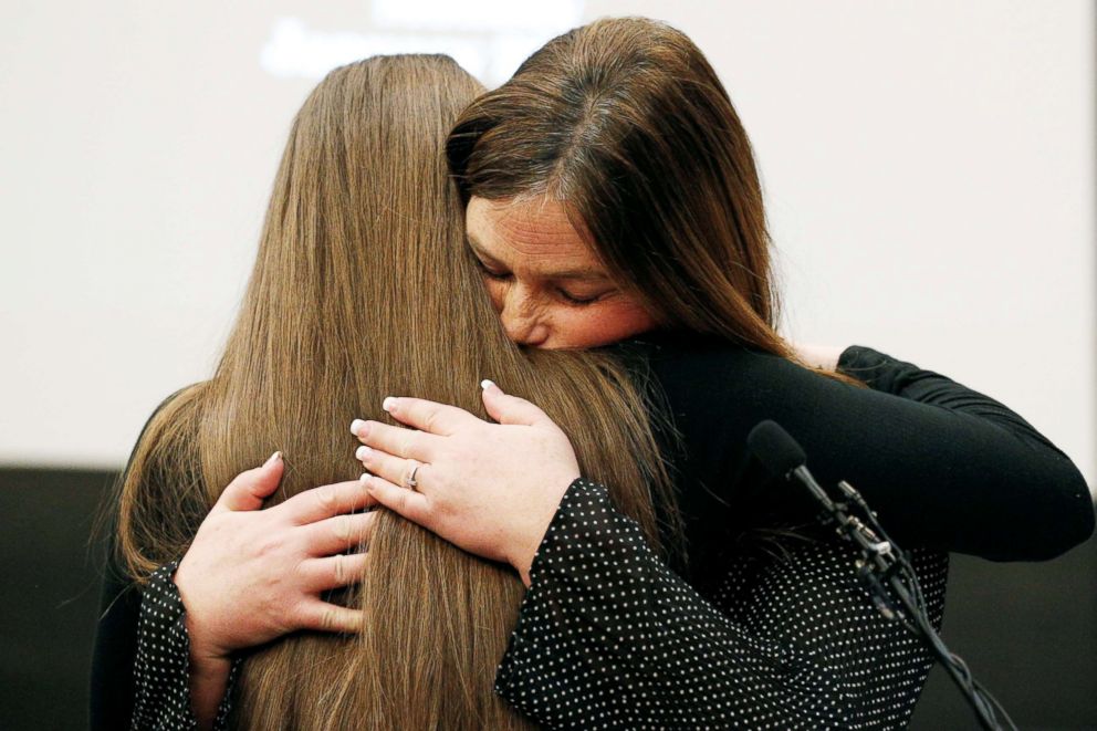 PHOTO: Victim Emma Ann Miller (L) is embraced by her mother Leslie Miller after Emma spoke at the sentencing hearing for Larry Nassar, in Lansing, Michi., on Jan. 22, 2018. 