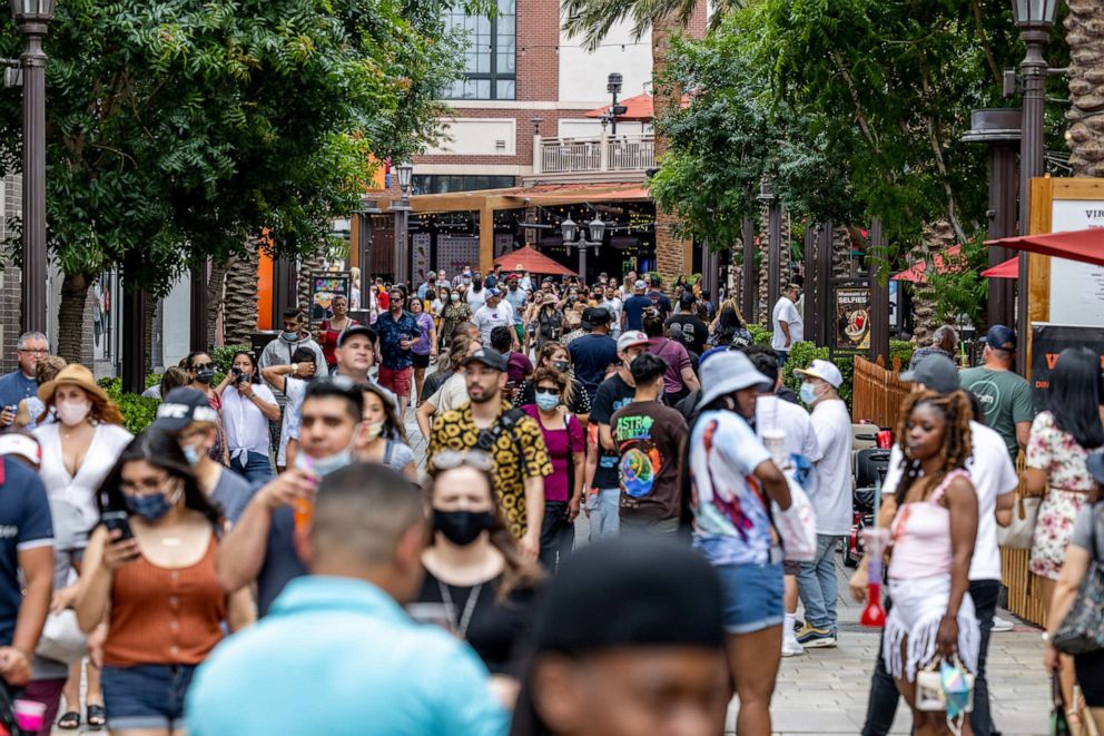 PHOTO: Pedestrians walk along the Linq Promenade shopping area in Las Vegas,  May 1, 2020. 