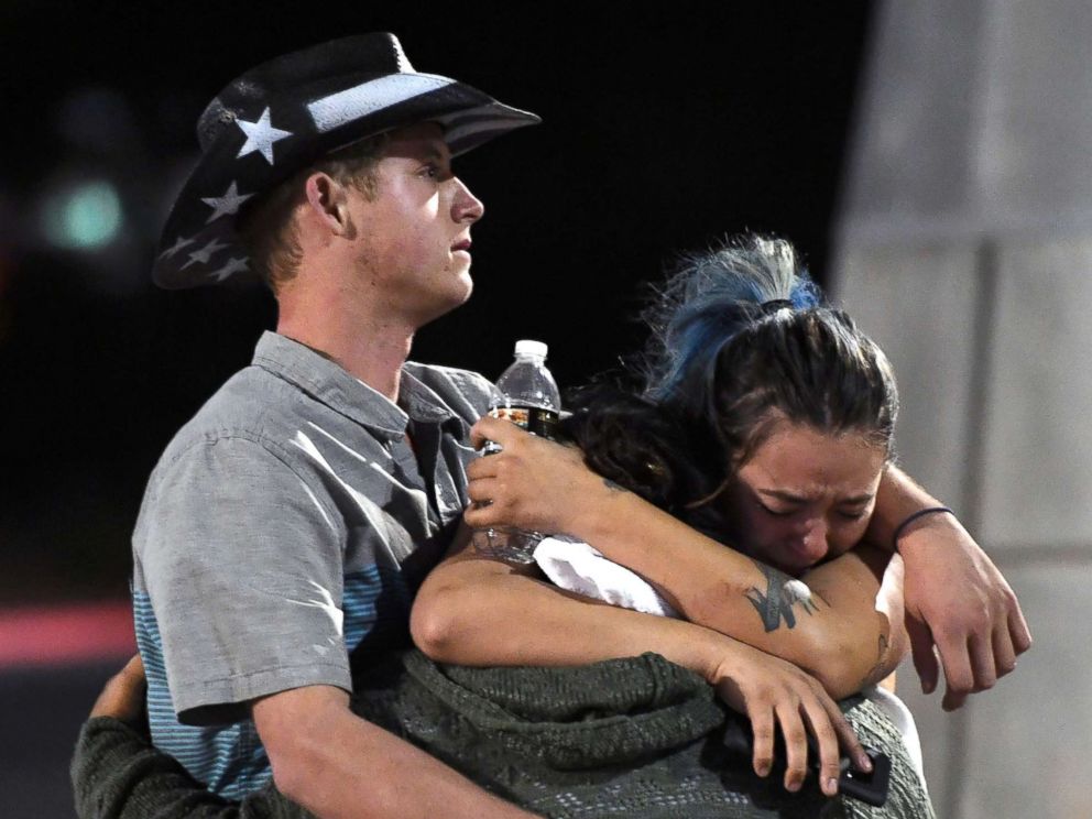 PHOTO: People hug and cry outside the Thomas & Mack Center after a mass shooting at the Route 91 Harvest country music festival, Oct. 2, 2017 in Las Vegas, Nevada.