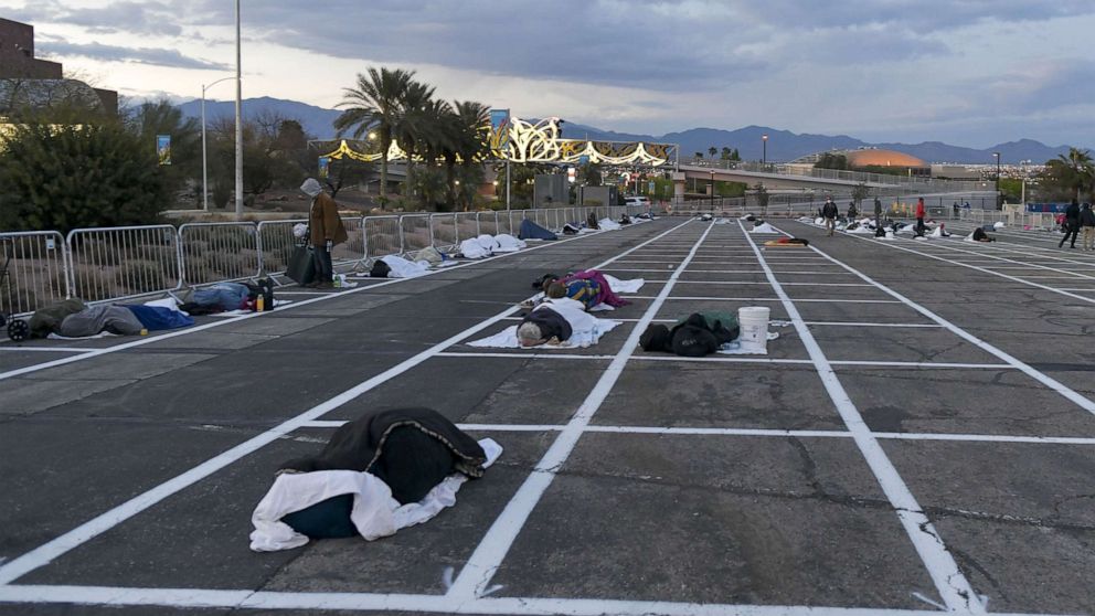 PHOTO: People sleep in spaces at a temporary homeless shelter at Cashman Center in Las Vegas, Nevada, March 29, 2020.
