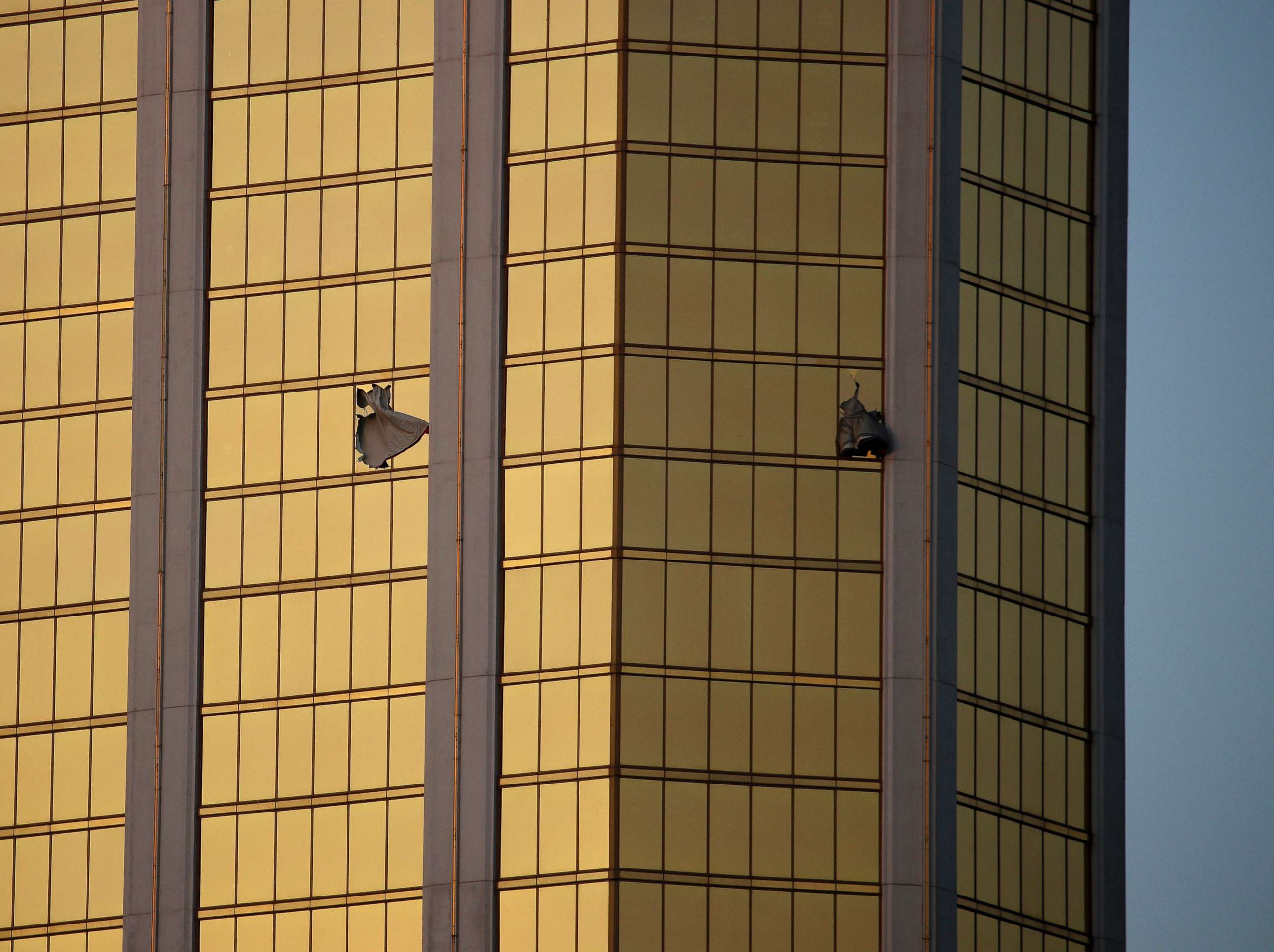 PHOTO: In this Monday, Oct. 2, 2017, file photo, drapes billow out of broken windows at the Mandalay Bay resort and casino on the Las Vegas Strip, following a mass shooting at a music festival in Las Vegas.
